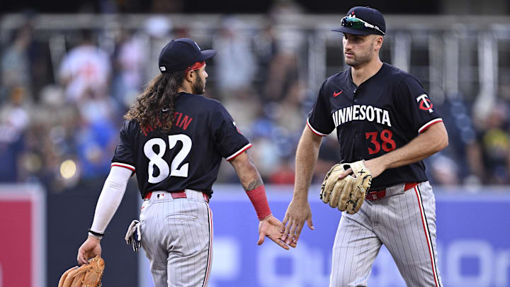 Aug 21, 2024; San Diego, California, USA; Minnesota Twins right fielder Matt Wallner (38) and left fielder Austin Martin (82) celebrate on the field after defeating the San Diego Padres at Petco Park. Mandatory Credit: Orlando Ramirez-Imagn Images