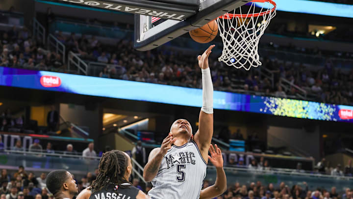 Feb 8, 2025; Orlando, Florida, USA; Orlando Magic forward Paolo Banchero (5) drives to the basket during the second quarter against the San Antonio Spurs at Kia Center. Mandatory Credit: Mike Watters-Imagn Images