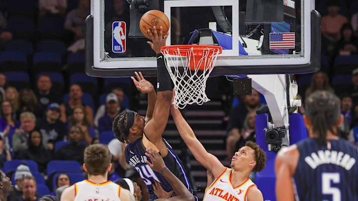 Orlando Magic center Wendell Carter Jr. (34) goes to the basket against Atlanta Hawks guard Dyson Daniels (5) during the first quarter at Kia Center. Orlando Magic center Wendell Carter Jr. (34) goes to the basket against Atlanta Hawks guard Dyson Daniels (5) during the first quarter at Kia Center.