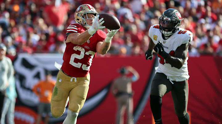 Nov 10, 2024; Tampa, Florida, USA; San Francisco 49ers running back Christian McCaffrey (23) catches the ball over Tampa Bay Buccaneers linebacker Lavonte David (54) during the second half at Raymond James Stadium. Mandatory Credit: Kim Klement Neitzel-Imagn Images Nov 10, 2024; Tampa, Florida, USA; San Francisco 49ers running back Christian McCaffrey (23) catches the ball over Tampa Bay Buccaneers linebacker Lavonte David (54) during the second half at Raymond James Stadium. Mandatory Credit: Kim Klement Neitzel-Imagn Images