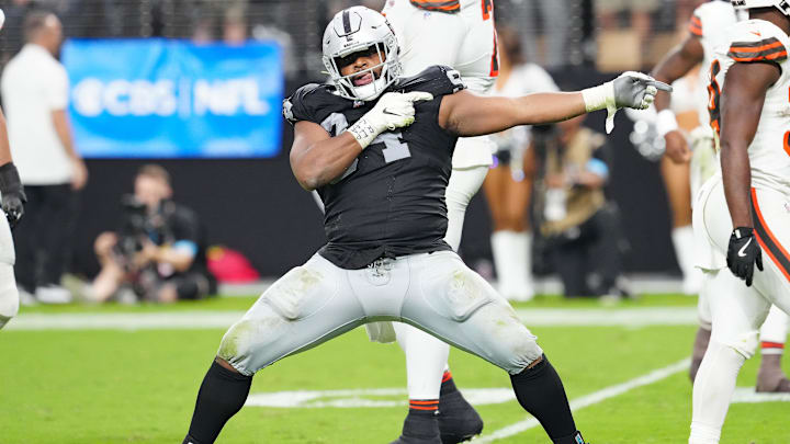 Las Vegas Raiders defensive tackle Christian Wilkins (94) celebrates after a penalty overturned a scoring play by the Cleveland Browns during the fourth quarter at Allegiant Stadium. Las Vegas Raiders defensive tackle Christian Wilkins (94) celebrates after a penalty overturned a scoring play by the Cleveland Browns during the fourth quarter at Allegiant Stadium.