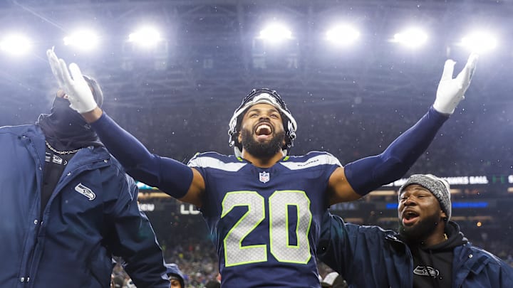 Dec 18, 2023; Seattle, Washington, USA; Seattle Seahawks safety Julian Love (20) celebrates on the bench after his second interception of the fourth quarter against the Philadelphia Eagles at Lumen Field. Mandatory Credit: Joe Nicholson-Imagn Images