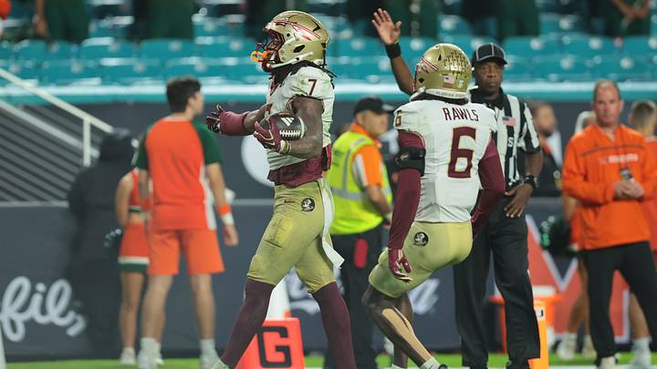 Oct 17, 2026; Miami Gardens, Florida, USA;  Florida State Seminoles defensive back Ashlynd Barker (7) celebrates after making an interception against the Miami Hurricanes during the third quarter at Hard Rock Stadium.  Mandatory Credit: Sam Navarro-Imagn Images