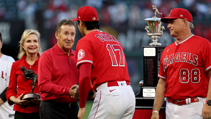 Oct 1, 2022; Anaheim, California, USA;  Los Angeles Angels owner Arte Moreno shakes hand with two-way player Shohei Ohtani (17) before a game against the Texas Rangers at Angel Stadium. Mandatory Credit: Kiyoshi Mio-Imagn Images