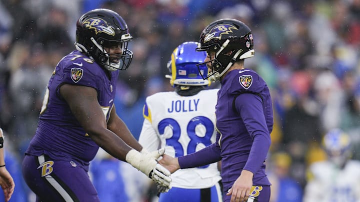 Baltimore Ravens offensive lineman John Simpson and place kicker Justin Tucker.