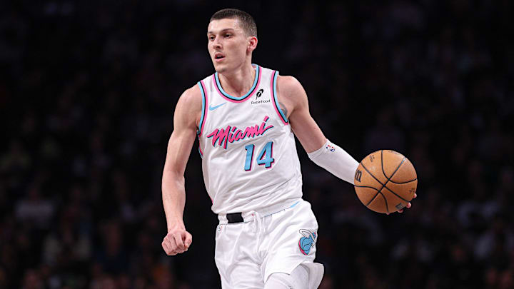 Feb 7, 2025; Brooklyn, New York, USA; Miami Heat guard Tyler Herro (14) dribbles up court during the second half against the Brooklyn Nets at Barclays Center. Mandatory Credit: Vincent Carchietta-Imagn Images