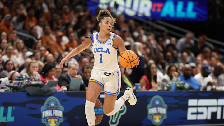 Apr 4, 2025; Tampa, FL, USA;  UCLA Bruins guard Kiki Rice (1) brings the ball up the court against the Connecticut Huskies during first quarter in a semifinal of the women's 2025 NCAA tournament at Amalie Arena. Mandatory Credit: Nathan Ray Seebeck-Imagn Images