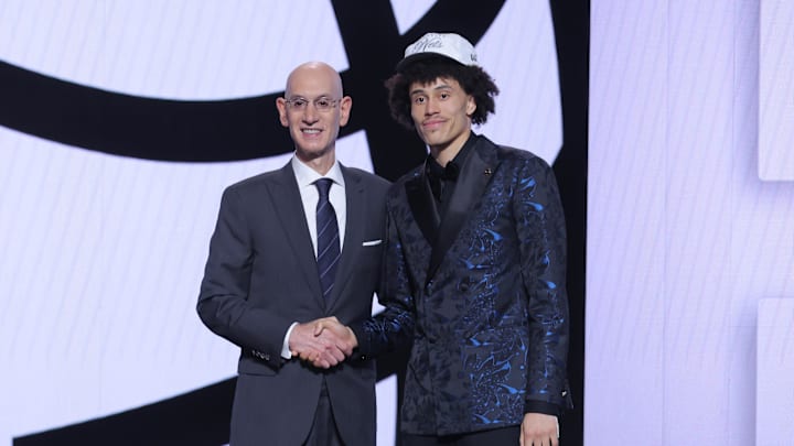 Jun 25, 2025; Brooklyn, NY, USA;  Nolan Traore stands with NBA commissioner Adam Silver after being selected as the 19th pick by the Brooklyn Nets in the first round of the 2025 NBA Draft at Barclays Center. Mandatory Credit: Brad Penner-Imagn Images