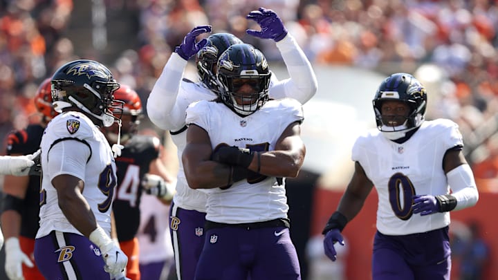 Oct 6, 2024; Cincinnati, Ohio, USA; Baltimore Ravens linebacker Tavius Robinson (95) celebrates a sack during the first half against the Cincinnati Bengals at Paycor Stadium. Mandatory Credit: Joseph Maiorana-Imagn Images Oct 6, 2024; Cincinnati, Ohio, USA; Baltimore Ravens linebacker Tavius Robinson (95) celebrates a sack during the first half against the Cincinnati Bengals at Paycor Stadium. Mandatory Credit: Joseph Maiorana-Imagn Images