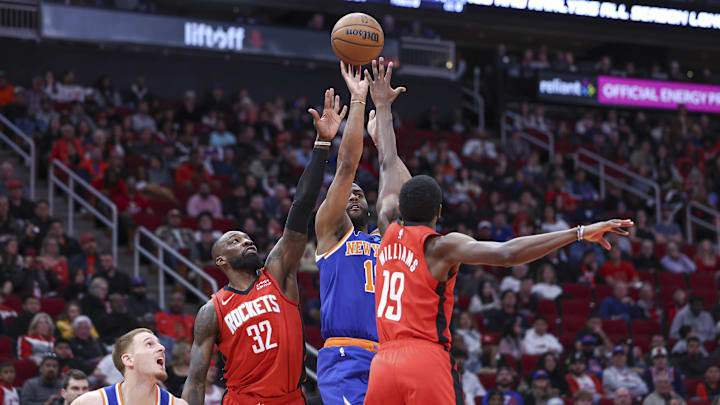 Feb 12, 2024; Houston, Texas, USA: New York Knicks guard Alec Burks (18) shoots the ball as Houston Rockets guard Nate Williams (19) and forward Jeff Green (32) defend during the fourth quarter at Toyota Center. Mandatory Credit: Troy Taormina-Imagn Images Feb 12, 2024; Houston, Texas, USA: New York Knicks guard Alec Burks (18) shoots the ball as Houston Rockets guard Nate Williams (19) and forward Jeff Green (32) defend during the fourth quarter at Toyota Center. Mandatory Credit: Troy Taormina-Imagn Images
