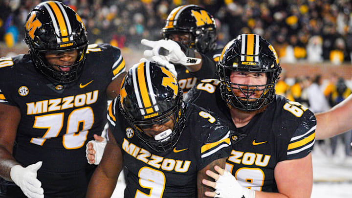 Nov 30, 2024; Columbia, Missouri, USA; Missouri Tigers running back Marcus Carroll (9) celebrates after scoring against the Arkansas Razorbacks during the second half at Faurot Field at Memorial Stadium. Mandatory Credit: Denny Medley-Imagn Images