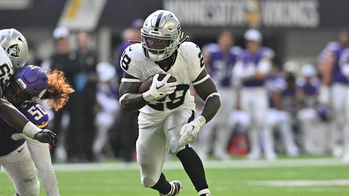 Aug 10, 2024; Minneapolis, Minnesota, USA; Las Vegas Raiders running back Sincere McCormick (28) runs the ball against the Minnesota Vikings during the third quarter at U.S. Bank Stadium. Mandatory Credit: Jeffrey Becker-Imagn Images Aug 10, 2024; Minneapolis, Minnesota, USA; Las Vegas Raiders running back Sincere McCormick (28) runs the ball against the Minnesota Vikings during the third quarter at U.S. Bank Stadium. Mandatory Credit: Jeffrey Becker-Imagn Images