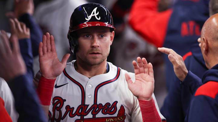 Atlanta Braves left fielder Jarred Kelenic (24) celebrates with teammates after scoring against the Philadelphia Phillies at Truist Park.