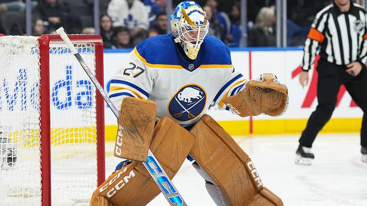 Dec 15, 2024; Toronto, Ontario, CAN; Buffalo Sabres goaltender Devon Levi (27) follows the play against the Toronto Maple Leafs during the third period at Scotiabank Arena. Mandatory Credit: Nick Turchiaro-Imagn Images