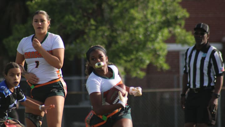 Mandarin's Madison Taylor (18) rushes for yardage against Stanton during the Gateway Conference flag football championship on April 21, 2022. [Clayton Freeman/Florida Times-Union]