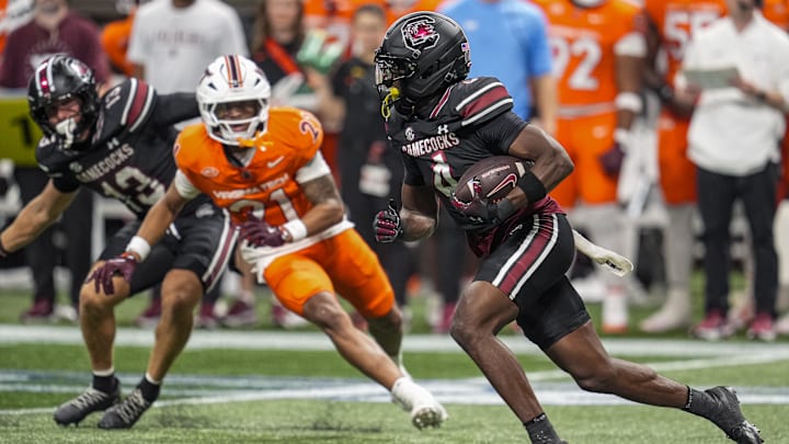 Aug 31, 2025; Atlanta, Georgia, USA; South Carolina Gamecocks defensive back Vicari Swain (4) returns a punt for a touchdown against the Virginia Tech Hokies during the second half at Mercedes-Benz Stadium. Mandatory Credit: Dale Zanine-Imagn Images