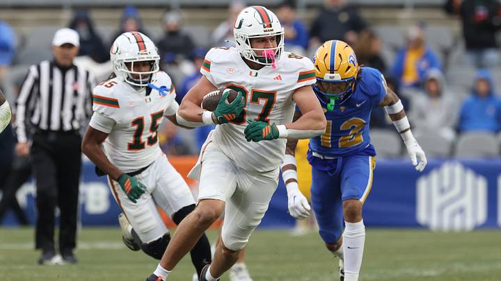 Nov 29, 2025; Pittsburgh, Pennsylvania, USA; Miami Hurricanes tight end Alex Bauman (87) runs after a catch  against the Pittsburgh Panthers during the third quarter at Acrisure Stadium. Mandatory Credit: Charles LeClaire-Imagn Images