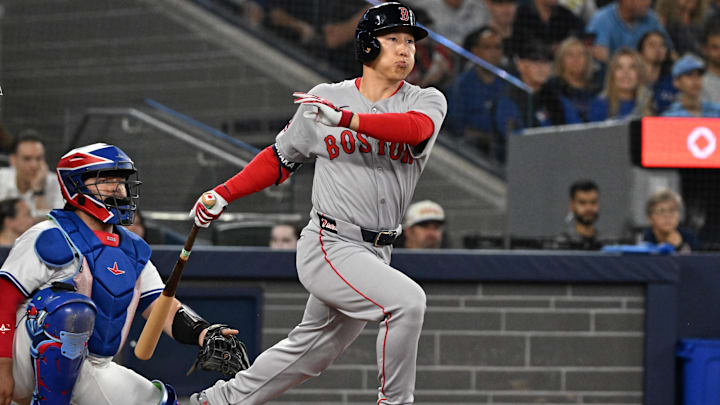 Sep 23, 2025; Toronto, Ontario, CAN;  Boston Red Sox designated hitter Masataka Yoshida (7) hits a double against the Toronto Blue Jays in the second inning at Rogers Centre. Mandatory Credit: Dan Hamilton-Imagn Images