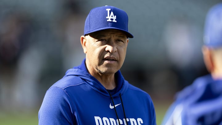 Apr 21, 2026; San Francisco, California, USA; Los Angeles Dodgers manager Dave Roberts (30) chats with a coach before a game against the San Francisco Giants at Oracle Park. Mandatory Credit: D. Ross Cameron-Imagn Images