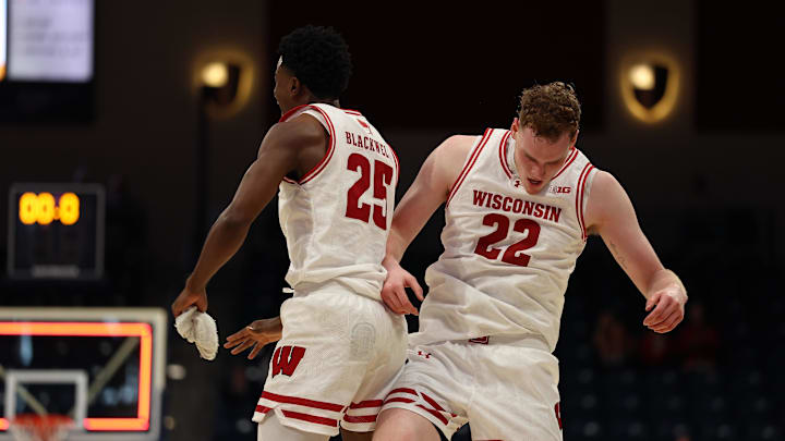 Nov 27, 2025; San Diego, CA, USA; Wisconsin Badgers forward Austin Rapp (22) reacts with Wisconsin Badgers guard John Blackwell (25) after scoring against the Providence Friars during the first half at Jenny Craig Pavilion. 
