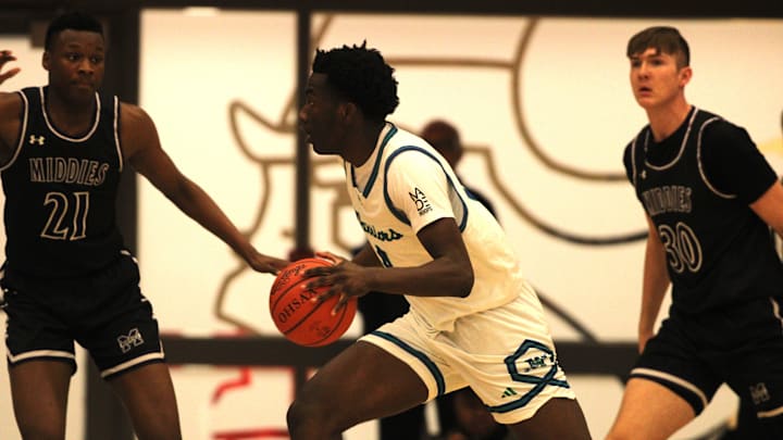 Middletown junior Dae'Shaun Showes guards Winton Woods senior Tyler McKinley during Middletown's 46-39 win over Winton Woods in an OHSAA Division I boys basketball sectional final March 1, 2024 at Princeton High School.