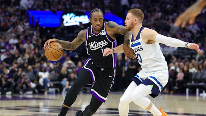 Oct 24, 2024; Sacramento, California, USA; Sacramento Kings forward DeMar DeRozan (10) dribbles the ball against Minnesota Timberwolves guard Donte DiVincenzo (0) during the second quarter at Golden 1 Center. Mandatory Credit: Sergio Estrada-Imagn Images