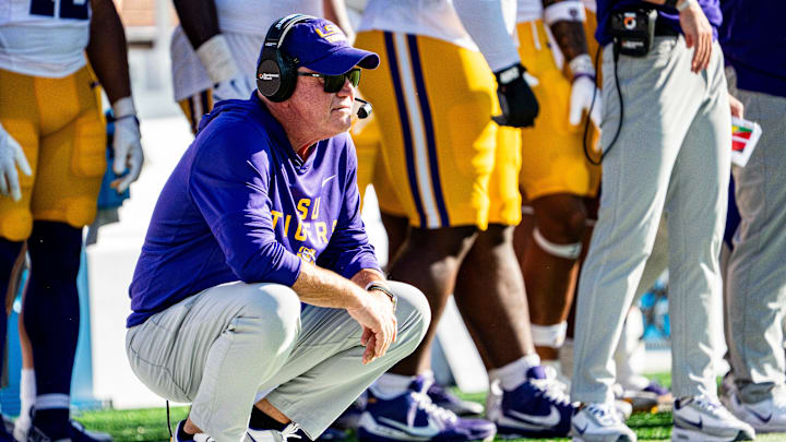 LSU head coach Brian Kelly crouches on the sidelines during a college football game between Ole Miss and LSU at Vaught-Hemingway Stadium in Oxford, Miss., on Saturday, Sept. 27, 2025.