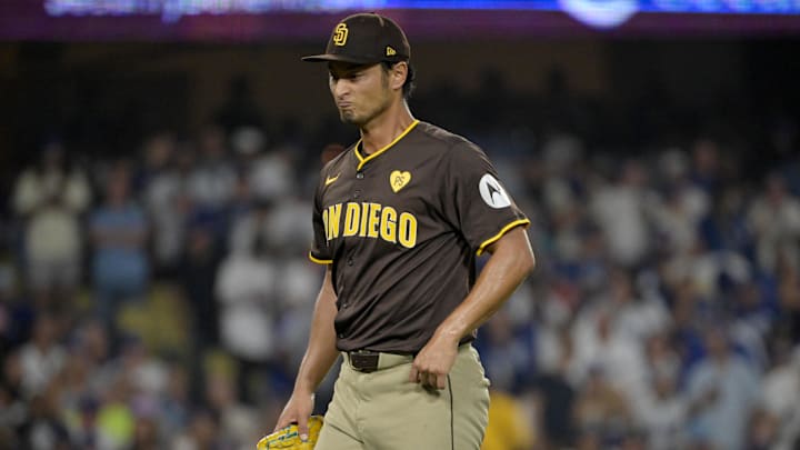 Oct 11, 2024; Los Angeles, California, USA; San Diego Padres pitcher Yu Darvish (11) reacts in the sixth inning against the Los Angeles Dodgers during game five of the NLDS for the 2024 MLB Playoffs at Dodger Stadium. Mandatory Credit: Jayne Kamin-Oncea-Imagn Images
