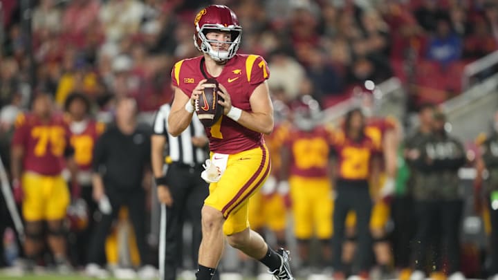 Oct 25, 2024; Los Angeles, California, USA; Southern California Trojans quarterback Miller Moss (7) throws the ball against the Rutgers Scarlet Knights in the first half at United Airlines Field at Los Angeles Memorial Coliseum. Mandatory Credit: Kirby Lee-Imagn Images