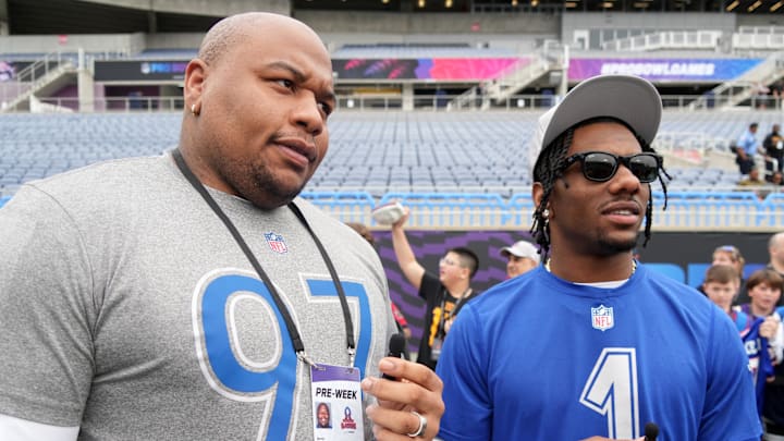 Feb 1, 2025; Orlando, FL, USA; New York Giants tackle Dexter Lawrence (99) interviews Giants receiver Malik Nabers (1) during NFC Practice for the Pro Bowl Games at Camping World Stadium. Mandatory Credit: Kirby Lee-Imagn Images