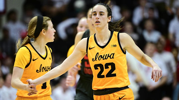 Feb 22, 2024; Bloomington, Indiana, USA; Iowa Hawkeyes guard Caitlin Clark (22) high-fives Iowa her teammate Molly Davis (1).