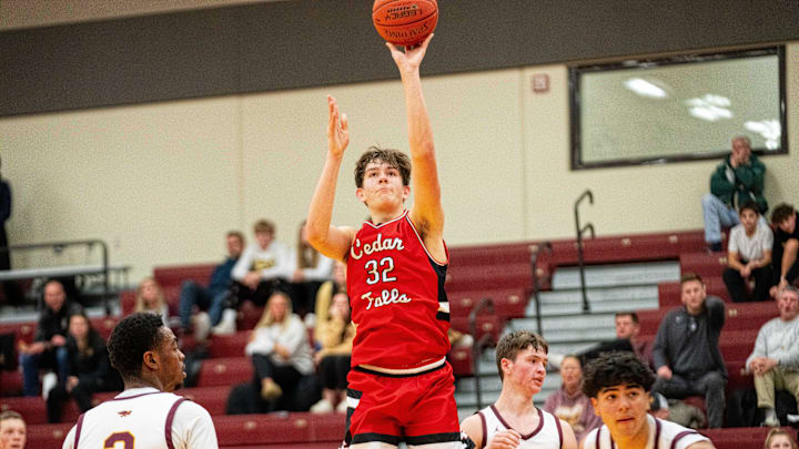 Cedar Falls' William Gerdes (32) takes a shot near the basket against Ankeny on Thursday, Dec. 19, 2024, at Ankeny High School.