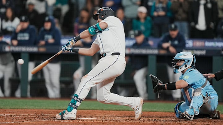 Oct 17, 2025; Seattle, Washington, USA; Seattle Mariners catcher Cal Raleigh (29) hits a solo home run against the Toronto Blue Jays in the eighth inning during game five of the ALCS round for the 2025 MLB playoffs at T-Mobile Park. Mandatory Credit: Stephen Brashear-Imagn Images Oct 17, 2025; Seattle, Washington, USA; Seattle Mariners catcher Cal Raleigh (29) hits a solo home run against the Toronto Blue Jays in the eighth inning during game five of the ALCS round for the 2025 MLB playoffs at T-Mobile Park. Mandatory Credit: Stephen Brashear-Imagn Images