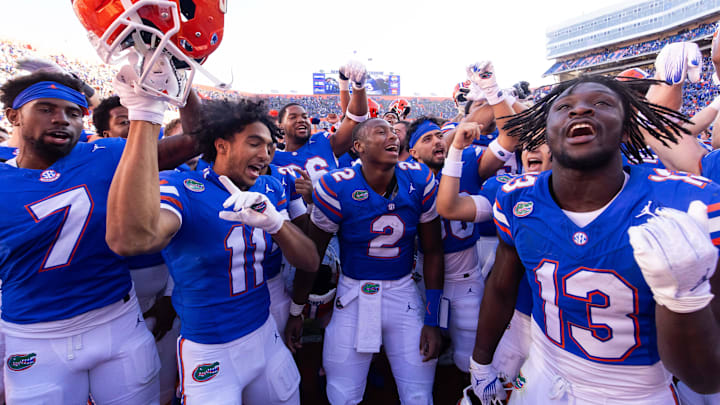 Florida Gators defensive back Trikweze Bridges (7), Florida Gators wide receiver Aidan Mizell (11), Florida Gators quarterback DJ Lagway (2) and Florida Gators running back Jadan Baugh (13) celebrateat Ben Hill Griffin Stadium in Gainesville, FL on Saturday, November 23, 2024. The Gators defeated the Rebels 24-17 [Doug Engle/Gainesville Sun]
