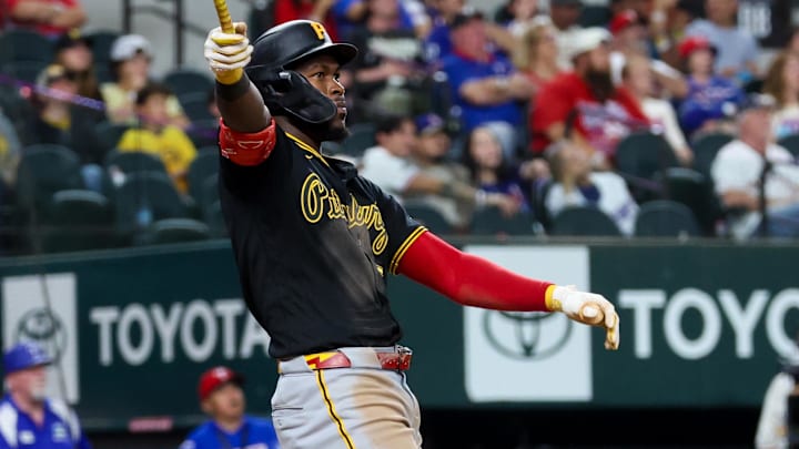 Apr 22, 2026; Arlington, Texas, USA;  Pittsburgh Pirates center fielder Oneil Cruz (15) hits a three-run home run during the ninth inning against the Texas Rangers at Globe Life Field. Mandatory Credit: Kevin Jairaj-Imagn Images
