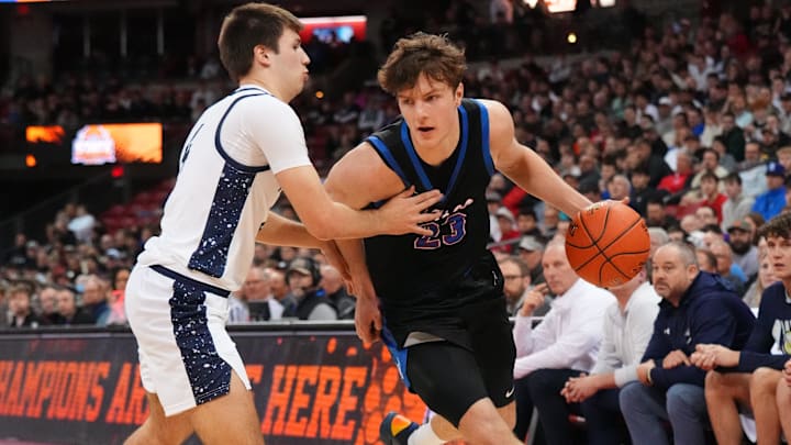 Wisconsin Lutheran's Zavier Zens (23) breaks around Appleton North's Nathan Ramus (4) during a WIAA Division 1 state semifinal game on March 20, 2026.