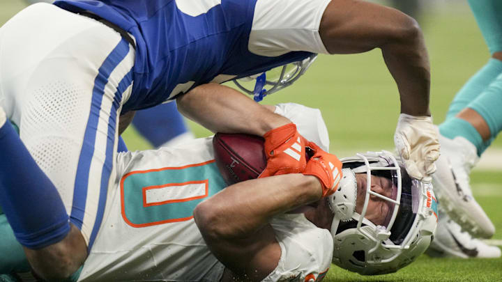 Oct 20, 2024; Indianapolis, Indiana, USA; Indianapolis Colts cornerback Kelvin Joseph (38) tackles Miami Dolphins wide receiver Braxton Berrios (0) during a game against the Miami Dolphins at Lucas Oil Stadium. 