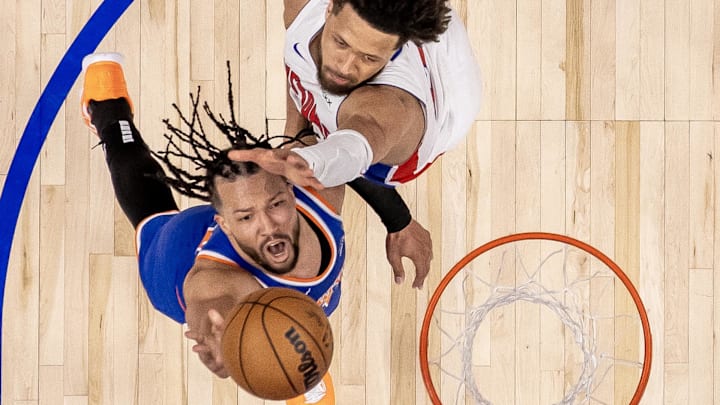 Apr 27, 2025; Detroit, Michigan, USA; New York Knicks guard Jalen Brunson (11) drives to the basket as Detroit Pistons guard Cade Cunningham (2) defends during the second half of game four of first round for the 2025 NBA Playoffs at Little Caesars Arena. Mandatory Credit: David Reginek-Imagn Images