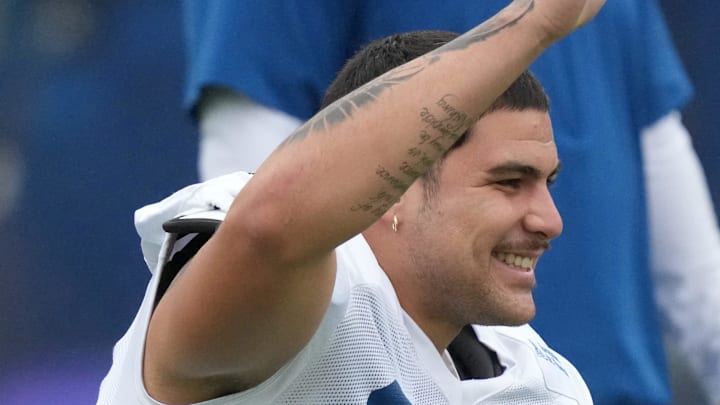 Indianapolis Colts defensive end Laiatu Latu (97) stretches during the Colts’ training camp Wednesday, Aug. 7, 2024, at Grand Park Sports Complex in Westfield.