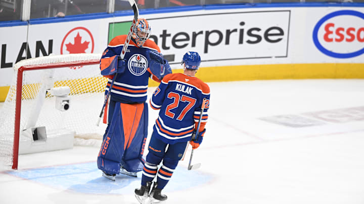 Edmonton Oilers goalie Stuart Skinner (74) celebrates their win with defenseman Brett Kulak (27)