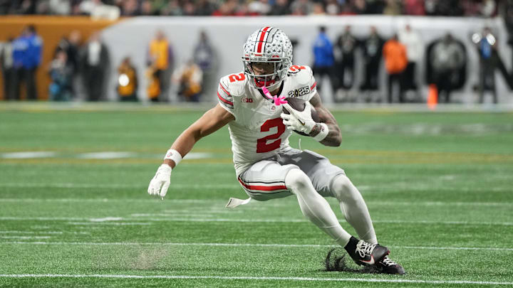 Ohio State Buckeyes wide receiver Emeka Egbuka runs the ball 