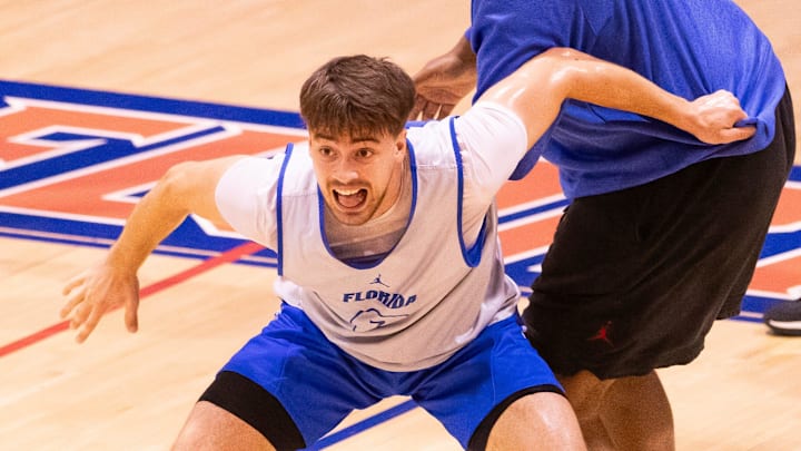 Florida Gators guard Urban Klavzar (7) works on a drill with Florida Gators Associate Head Coach Carlin Hartman during the Florida Gators men’s basketball teams practice on John W. Frost II Practice Court in Gainesville, FL on Tuesday, September 24, 2024. [Doug Engle/Gainesville Sun]