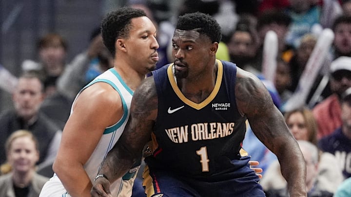 New Orleans Pelicans forward Zion Williamson (1) handles the ball against Charlotte Hornets forward Grant Williams New Orleans Pelicans forward Zion Williamson (1) handles the ball against Charlotte Hornets forward Grant Williams