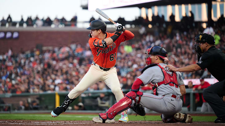 Aug 8, 2025; San Francisco, California, USA; San Francisco Giants right fielder Drew Gilbert (61) bats against Washington Nationals catcher Drew Millas (81) in his MLB debut during the second inning at Oracle Park. Mandatory Credit: Robert Edwards-Imagn Images