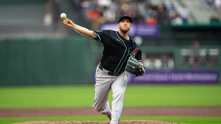 May 12, 2025; San Francisco, California, USA; Arizona Diamondbacks starting pitcher Merrill Kelly (29) delivers a pitch against the San Francisco Giants during the first inning at Oracle Park. Mandatory Credit: Neville E. Guard-Imagn Images