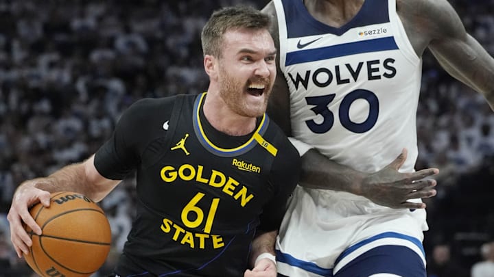 May 6, 2025; Minneapolis, Minnesota, USA; Golden State Warriors guard Pat Spencer (61) goes to the basket against Minnesota Timberwolves forward Julius Randle (30) in the third quarter during game one of the second round for the 2025 NBA Playoffs at Target Center. Mandatory Credit: Bruce Kluckhohn-Imagn Images
