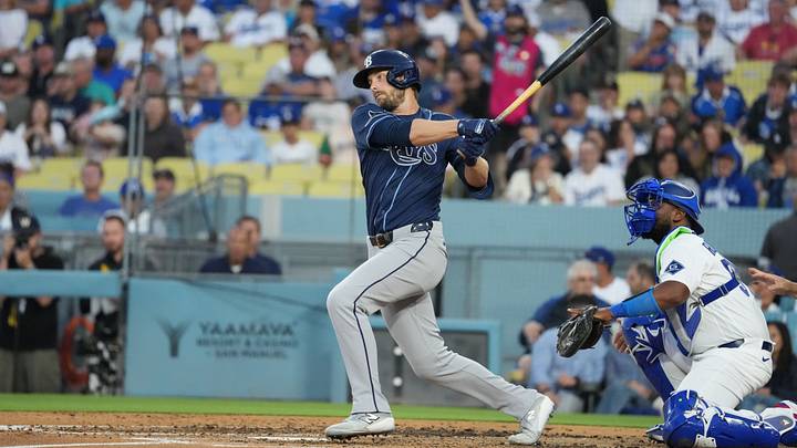 Jun 16, 2026; Los Angeles, California, USA; Tampa Bay Rays right fielder Austin Slater (20) hits a single during the fourth inning against the Los Angeles Dodgers at Dodger Stadium. Mandatory Credit: Kirby Lee-Imagn Images