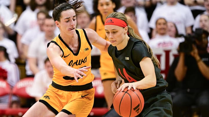 Feb 22, 2024; Bloomington, Indiana, USA; Iowa Hawkeyes guard Caitlin Clark (22) defends against