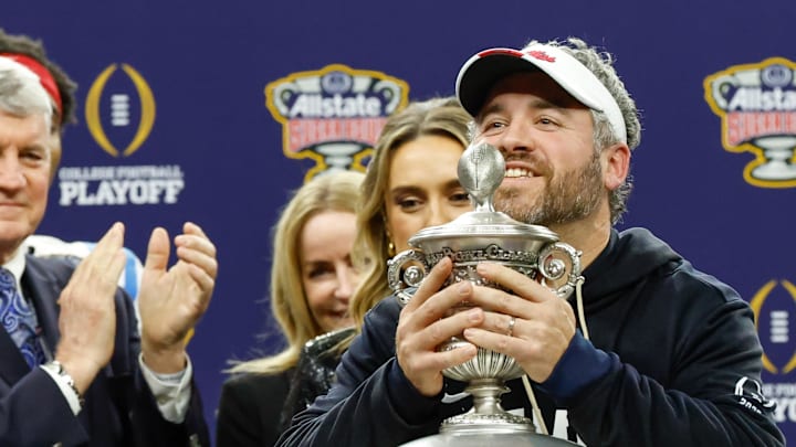 Jan 1, 2026; New Orleans, LA, USA; Mississippi Rebels head coach Pete Golding lifts the trophy after the 2025 Sugar Bowl and quarterfinal game of the College Football Playoff against the Georgia Bulldogs at Caesars Superdome. Mandatory Credit: Amber Searls-Imagn Images