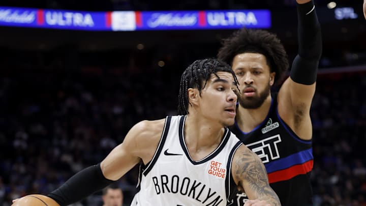 Mar 1, 2025; Detroit, Michigan, USA;  Brooklyn Nets guard Killian Hayes (7) dribbles defended by Detroit Pistons guard Cade Cunningham (2) in the first half at Little Caesars Arena. Mandatory Credit: Rick Osentoski-Imagn Images